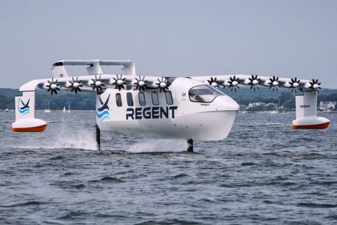 NORTH KINGSTOWN, R.I. — The winged passenger ferry gliding over the surface of Narragansett Bay could be a new method of coastal transportation or a new kind of warship.
Its maker, Regent Craft, is betting on both.
Twelve quietly buzzing propellers line the 65-foot wingspan of Paladin, a sleek ship with an airplane’s nose. It looks nothing like the sailboats and fishing trawlers it speeds past through New England’s largest estuary.
“We had this vision five years ago for a seaglider — something that is as fast as an aircraft and as easy to drive as a boat,” said CEO Billy Thalheimer, jubilant after an hours-long test run of the new vessel.
On a cloudy August morning, Thalheimer sat in the Paladin’s cockpit and, for the first time, took control of his company’s prototype craft to test its hydrofoils. The electric-powered watercraft has three modes — float, foil and fly.
Billy Thalheimer, CEO and co-founder of REGENT, gestures after piloting the Viceroy Seaglider, a winged passenger ferry, following a test run on Narragansett Bay on Aug. 6.Charles Krupa / AP
From the dock, it sets off like any motorized boat. Farther away from land, it rises up on hydrofoils — the same kind used by sailing ships that compete in America’s Cup. The foils enable it to travel more than 50 miles per hour — and about a person’s height — above the bay.
What makes this vessel so unusual is that it’s designed to soar about 30 feet above the water at up to 180 miles per hour — a feat that hasn’t quite happened yet, with the first trial flights off Rhode Island’s seacoast planned for the end of summer or early fall.
If successful, the Paladin will coast on a cushion of air over Rhode Island Sound, lifting with the same “ground effect” that pelicans, cormorants and other birds use to conserve energy as they swiftly glide over the sea. It could zoom to New York City — which takes at least three hours by train and longer on traffic-clogged freeways — in just an hour.
As it works to prove its seaworthiness to the U.S. Coast Guard and other regulators around the world, Regent is already lining up future customers for commercial ferry routes around Florida, Hawaii, Japan and the Persian Gulf.
Regent is also working with the U.S. Marines to repurpose the same vessels for island-hopping troops in the Pacific. Those vessels would likely trade electric battery power for jet fuel to cover longer journeys.
With backing from influential investors including Peter Thiel and Mark Cuban, Thalheimer says he’s trying to use new technology to revive the “comfort and refined nature” of 1930s-era flying boats that were popular in aviation’s golden age before they were eclipsed by commercial airlines.
This time, Thalheimer added, they’re safer, quieter and emission-free.
“I thought they made travel easier in a way that made total sense to me,” Cuban said by email this week. “It’s hard to travel around water for short distances. It’s expensive and a hassle. Regent can solve this problem and make that travel fun, easy and efficient.”
Co-founders and friends Thalheimer, a skilled sailor, and chief technology officer Mike Klinker, who grew up lobster fishing, met while both were freshmen at the Massachusetts Institute of Technology and later worked together at Boeing. They started Regent in 2020.
They’ve already tested and flown a smaller model. But the much bigger, 12-passenger Paladin — prototype of a product line called Viceroy — began foil testing this summer after years of engineering research and development. A manufacturing facility is under construction nearby, with the vessels set to carry passengers by 2027.
The International Maritime Organization classifies “wing-in-ground-effect” vehicles such as Regent’s as ships, not aircraft. But a database of civilian ships kept by the London-based organization lists only six around the world, all of them built before it issued new safety guidance on such craft in 2018 following revisions sought by China, France and Russia.
The IMO says it treats them as marine vessels because they operate in the vicinity of other watercraft and must use the same rules for avoiding collisions. The Coast Guard takes a similar approach.
“You drive it like a boat,” Thalheimer said. “If there’s any traffic on the harbor, you’ll see it on the screen. If you see a boat, you’d go around it. We’re never flying over boats or anything like that.”
The REGENT Viceroy Seaglider on a test run on Aug. 6.Charles Krupa / AP
One of the biggest technical challenges in Regent’s design is the shift from foiling to flying. Hydrofoils are fast for a seafaring vessel, but far slower than the speeds needed to lift a conventional airplane from a runway.
That’s where air blown by the 12 propellers comes in, effectively tricking the wing into generating high lift at low speeds.
All of this has worked perfectly on the computer simulations at Regent’s headquarters in North Kingstown, Rhode Island. The next step is testing it over the water.
For decades, the only warship known to mimic such a ground-effect design was the Soviet Union’s hulking ekranoplan, which was built to fly under radar detection but never widely used. Recently, however, social media images of an apparent Chinese military ekranoplan have caught the attention of naval experts amid increasingly tense international disputes in the South China Sea.
Regent has capitalized on those concerns, pitching its gliders to the U.S. government as a new method for carrying troops and cargo across island chains in the Indo-Pacific region. It could also do clandestine intelligence collection, anti-submarine warfare and be a “mothership” for small drones, autonomous watercraft or medical evacuations, said Tom Huntley, head of Regent’s government relations and defense division.
They fly below radar and above sonar, which makes them “really hard to see,” Huntley said.
While the U.S. military has shown increasing interest, questions remain about their detectability, as well as their stability in various sea states and wind conditions, and their “cost at scale beyond a few prototypes and maintainability,” said retired U.S. Navy Capt. Paul S. Schmitt, an associate research professor at the Naval War College, across the bay in Newport, Rhode Island.
Schmitt, who has seen Paladin from afar while sailing, said he also has questions about what kind of military mission would fit Regent’s “relatively short range and small transport capacity.”
The possibilities that most excite Cuban and other Regent backers are commercial.
Driving Interstate 95 through all the cities that span Florida’s Atlantic Coast can take the better part of a day, which is one reason why Regent is pitching Miami as a hub for its coastal ferry trips.
The Viceroy seagliders can already carry more passengers than the typical seaplane or helicopter, but a growing number of electric hydrofoil startups, such as Sweden’s Candela and California-based Navier, are trying to stake out ferry routes around the world.
Thalheimer sees his vehicles as more of a complement than a competitor to electric hydrofoils that can’t travel as fast, since they will all use the same docks and charging infrastructure but could specialize in different trip lengths.
This post appeared first on NBC NEWS