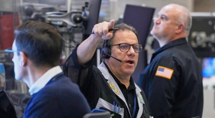 Stock market sinks as AI and interest rate worries grip investors